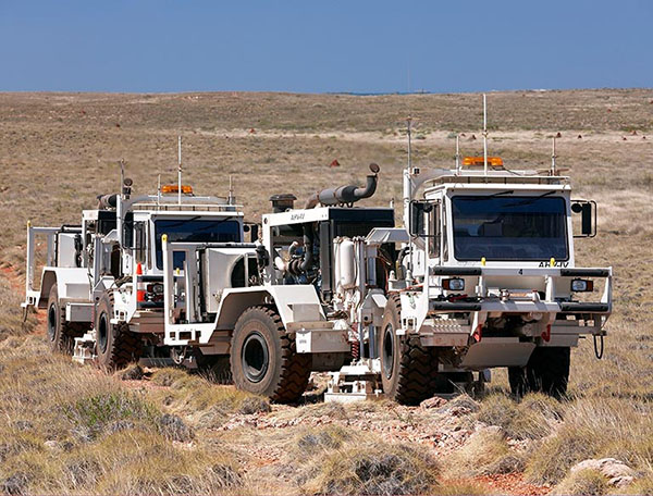 Vibroseis trucks performing CO2 baseline survey