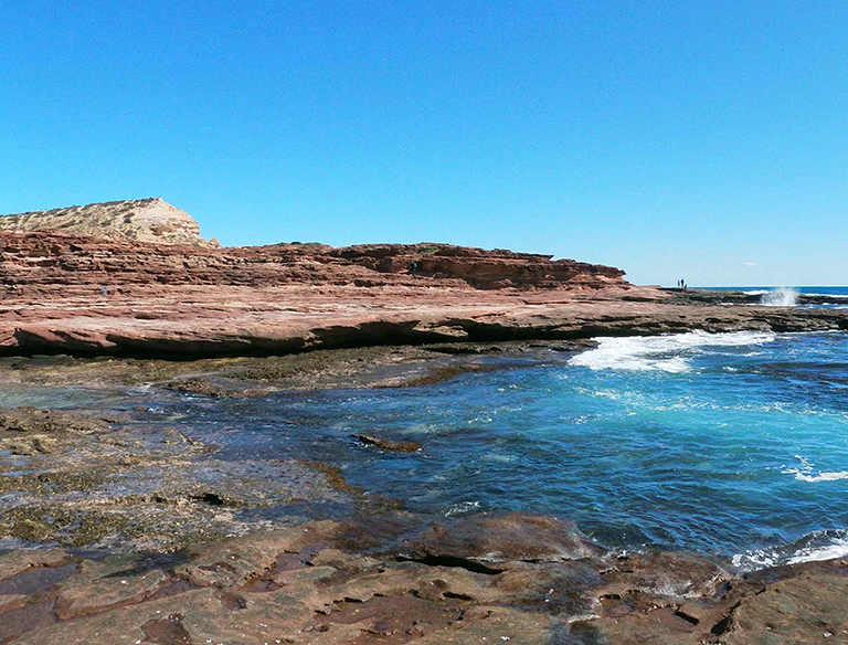 Treacherous Waters: The beautiful, turquoise waters, sheltered by spectacular red rock, make a perfect habitat for many crustaceans and fish.