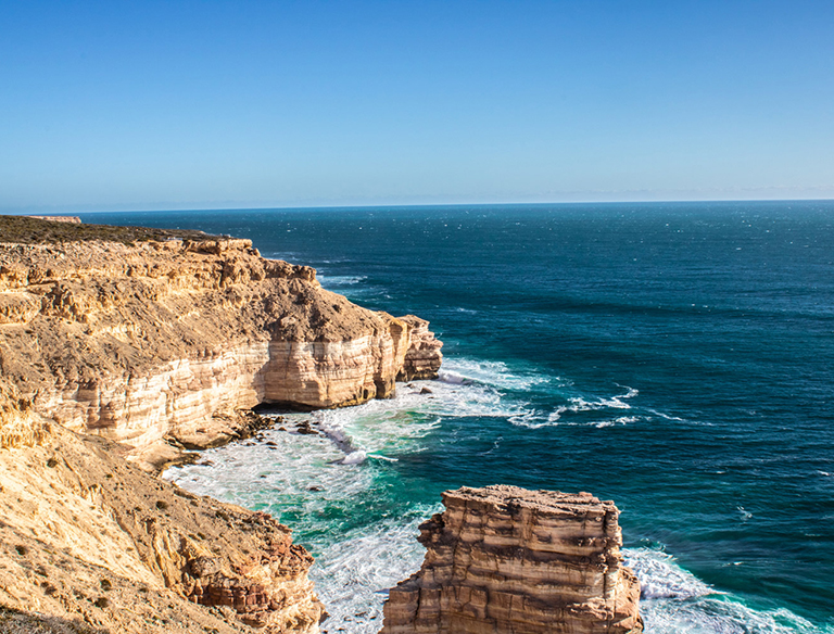 West Aussie Coastline: The Indian Ocean thunders against the West Australian coastline, a grand abode for the diverse marine life that resides there.