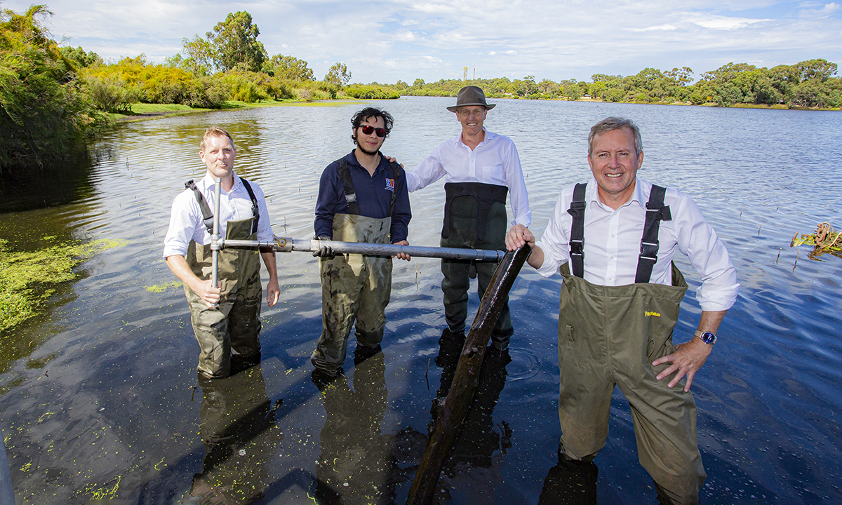 A blue carbon scientist takes a soil sample at the Beeliar Wetlands