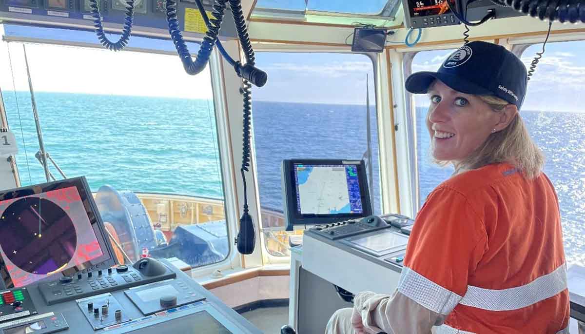 Deanne Renting - Finalist for the 2022 Outstanding Woman in Resources Award Deanne Renting, Wheatstone Production Manager, at the helm of one of a tug boat at the Wheatstone LNG terminal