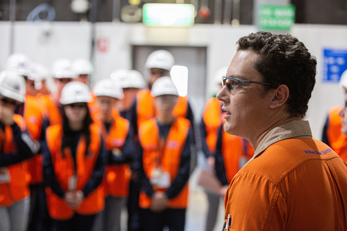 Male staff member briefs RTS On Tour students at Chevron-operated Wheatstone