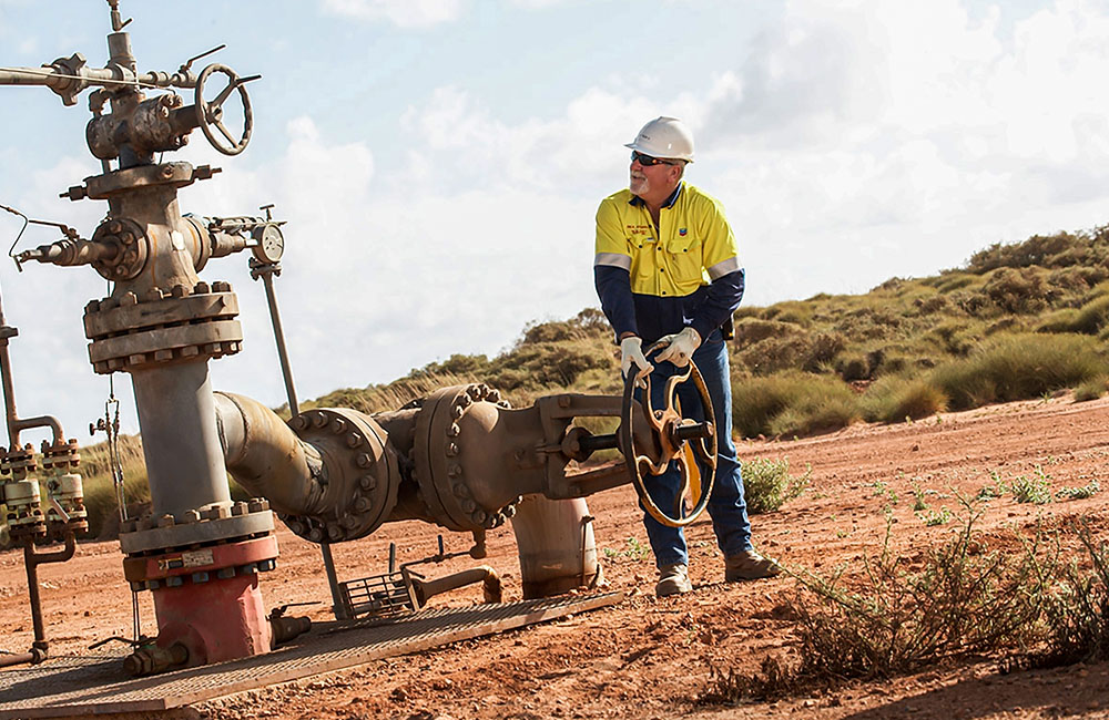 A worker using WA oil equipment on Barrow Island