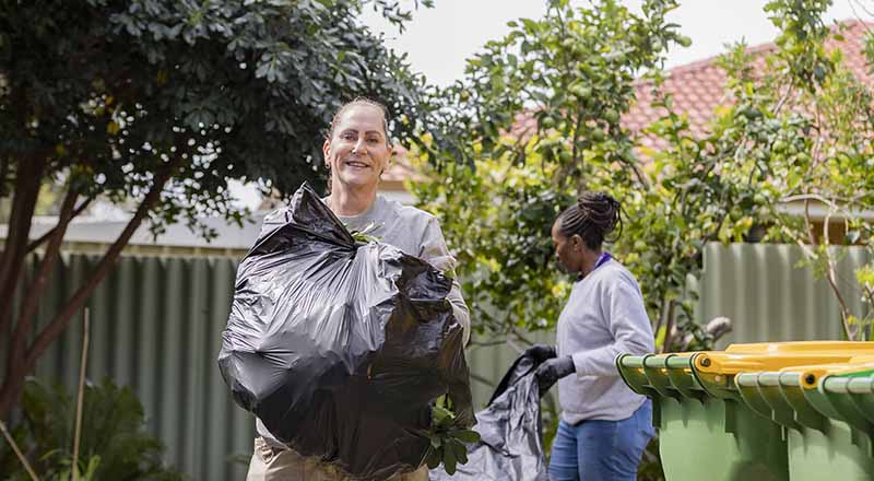 Members of Chevron Australia's Women Network doing volunteer gardening work at a Zonta House refuge.